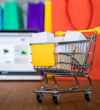 a shopping cart with a sticky note on it