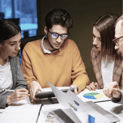 four people having a meeting